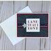 A patriotic greeting card made with denim patterned scrapbook paper, red cardstock, a stamped sentiment, a silver star and patriotic ribbon.